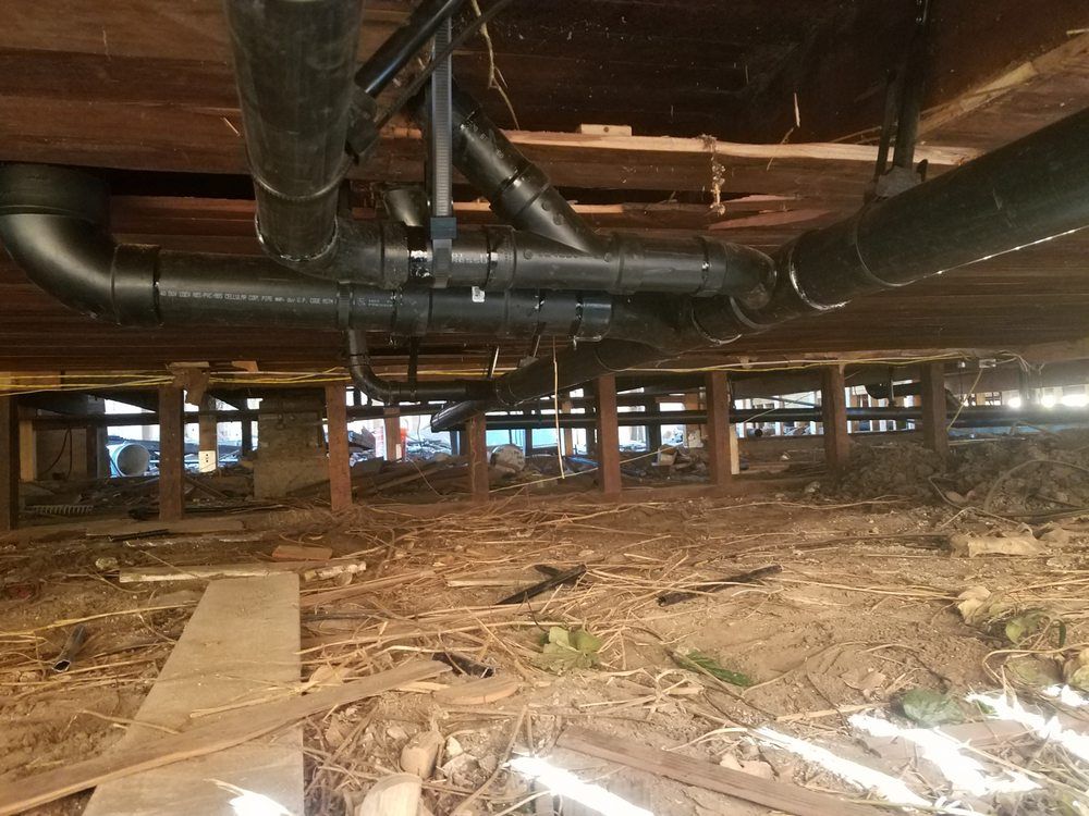 Crawlspace ABS drain piping installation